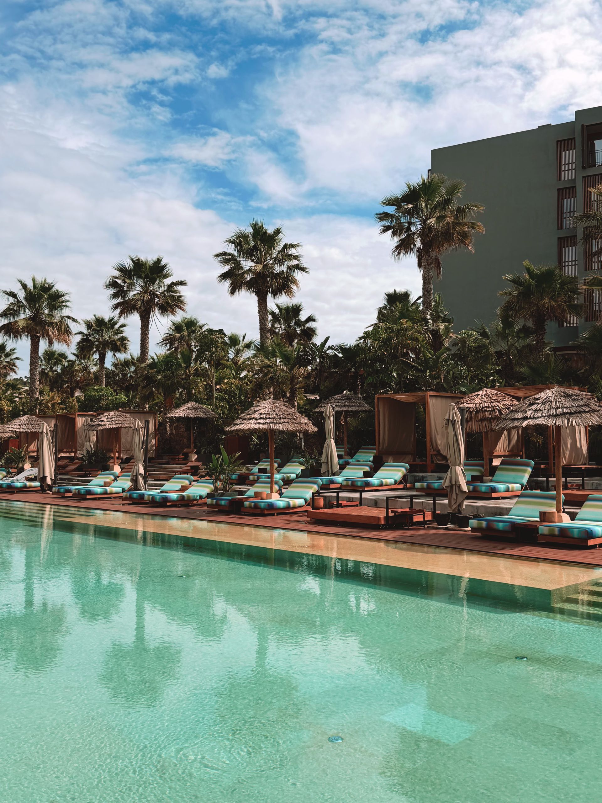 Outdoor dining and poolside seating at a premium destination